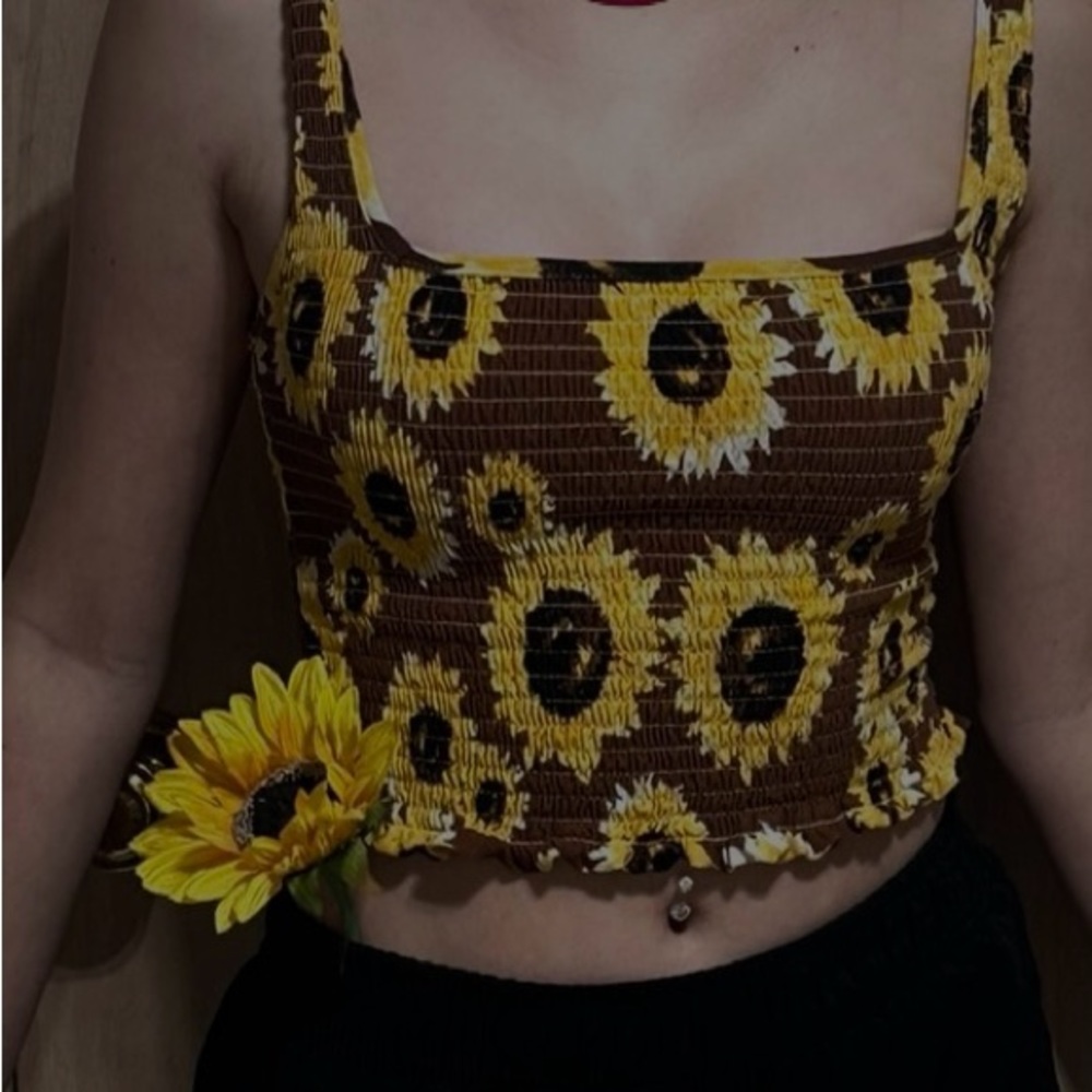 Beautiful crop top with lots of sun flowers! Size small! Color is yellow & brown